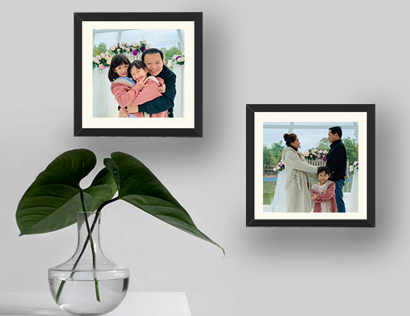 Family personalised photo frame on a wall
