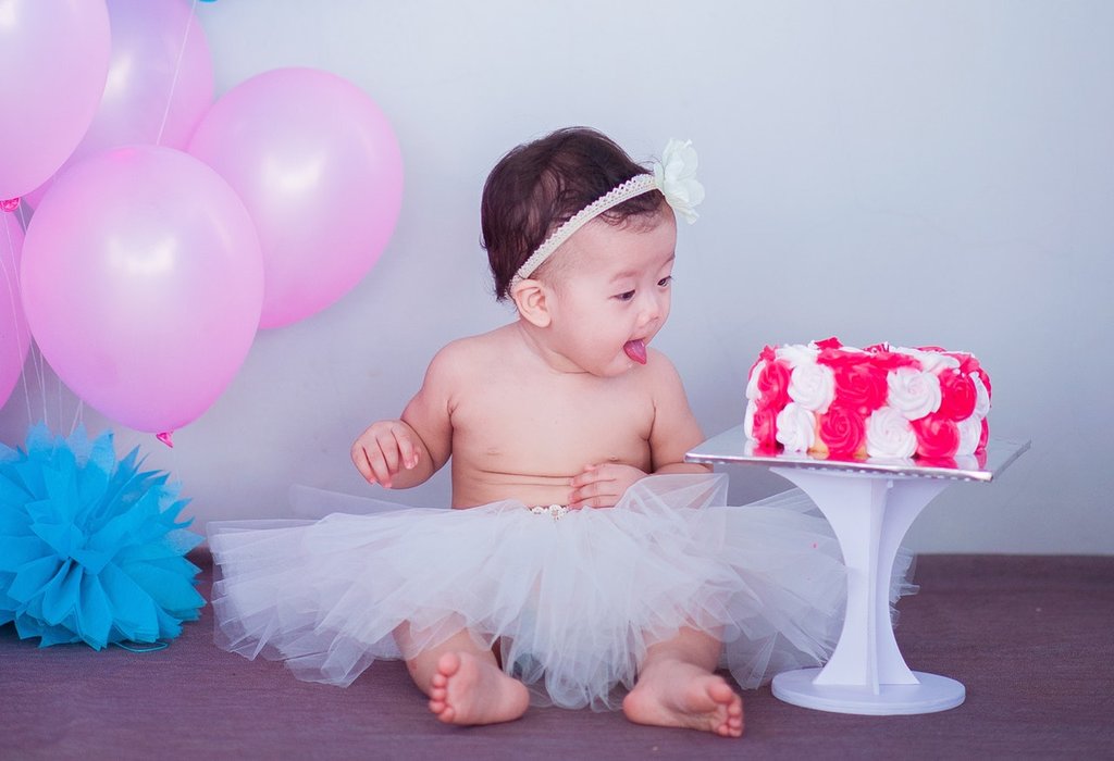  Baby near a cake