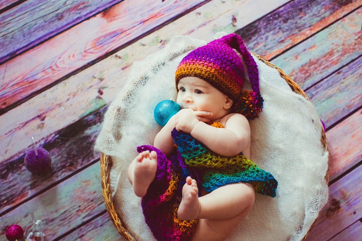 Vibrant rainbow-inspired newborn baby photoshoot bursting with colors in Singapore