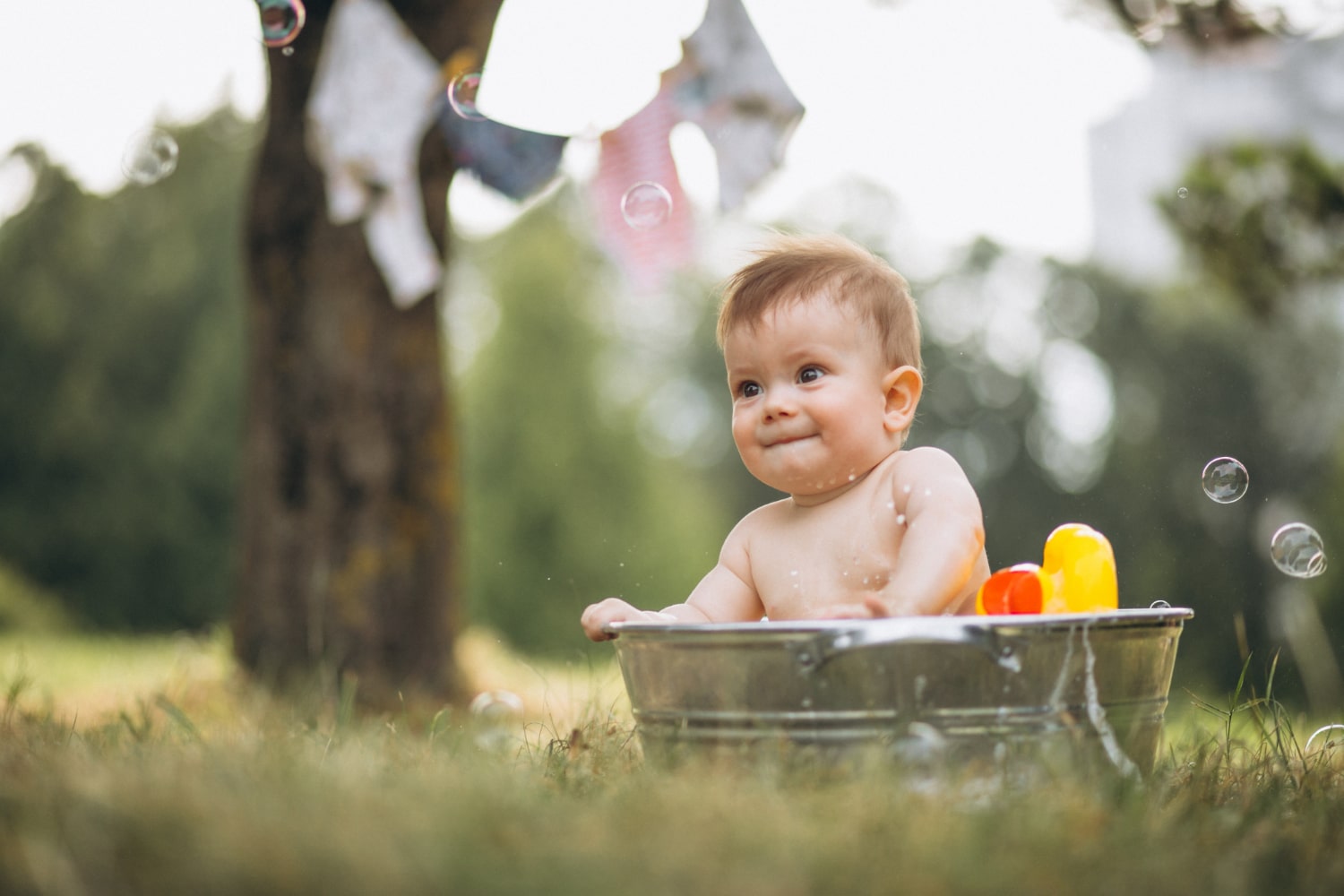 Bubble bath fun captured in a delightful newborn baby photoshoot