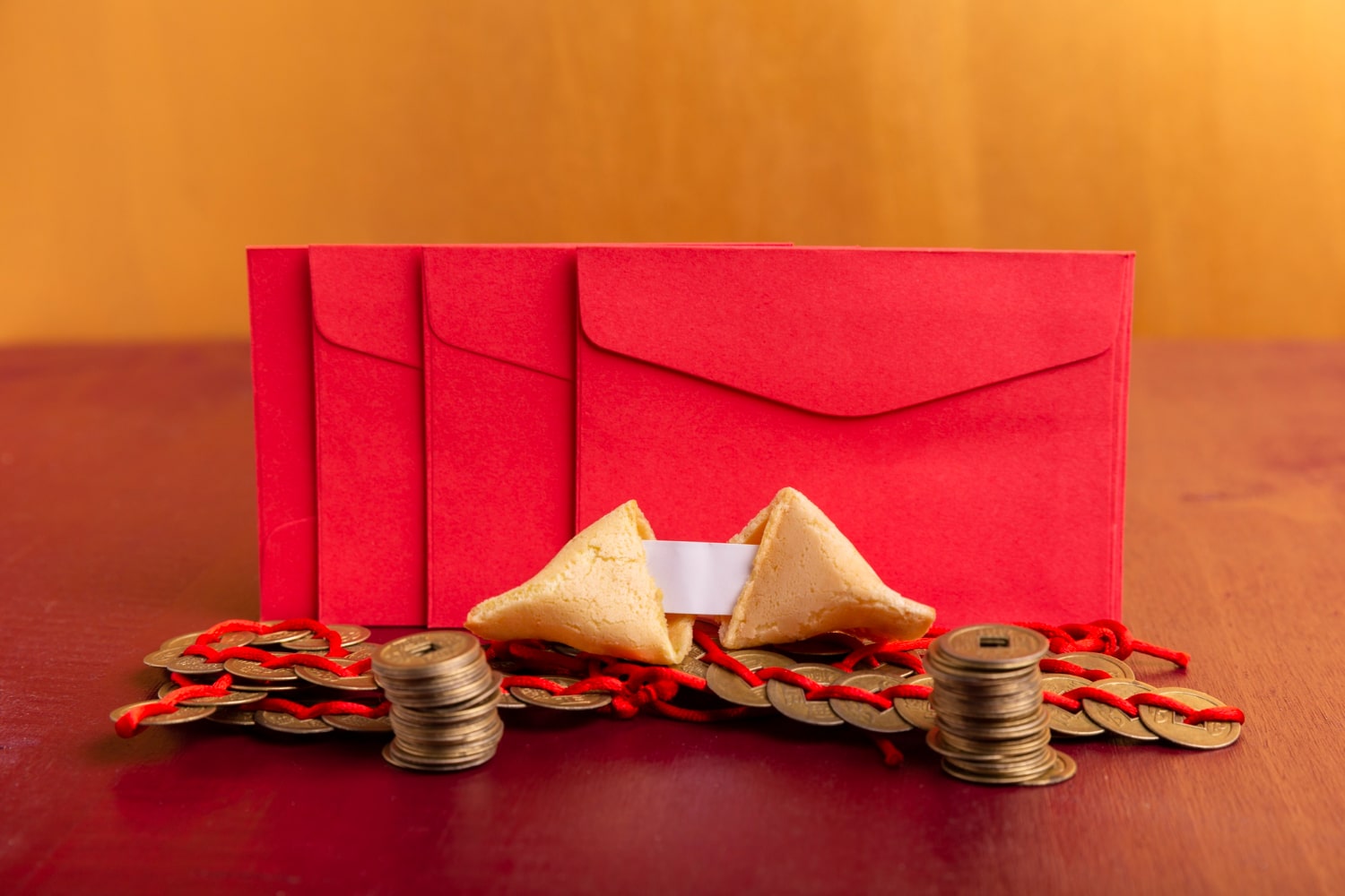 Chinese New Year joy with a modern touch—a red envelope adorned with coins and red pape