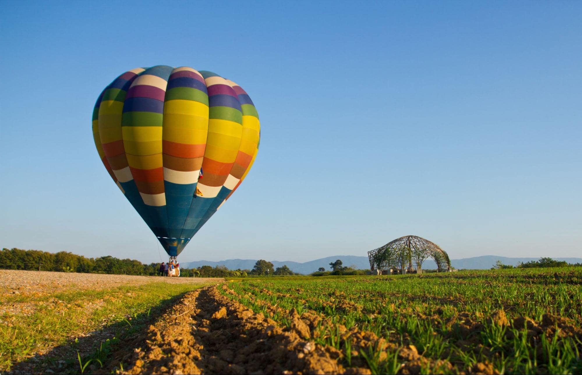 Hot air balloon in field—adventurous birthday gift experience for girlfriend