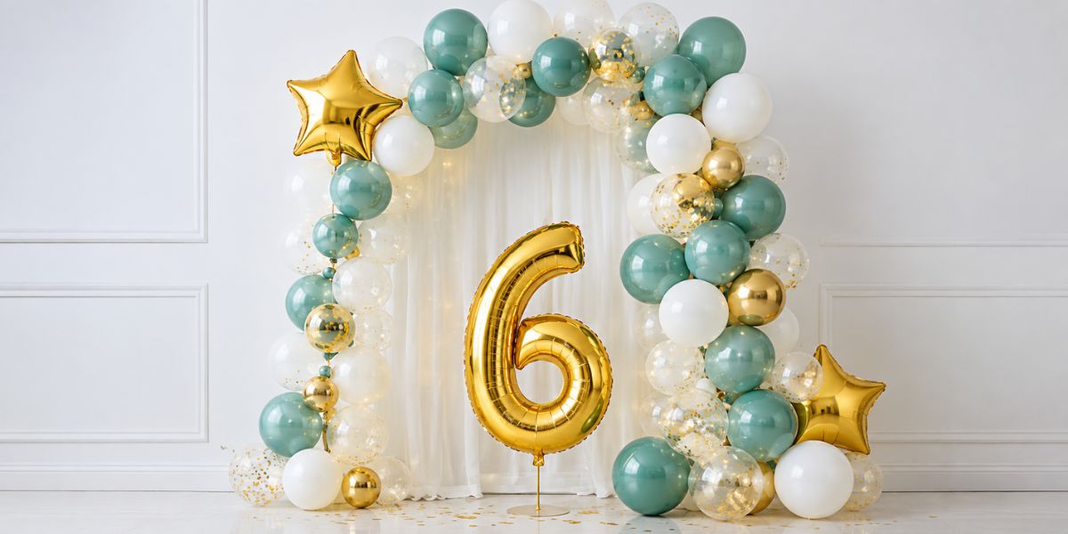 Colourful balloon arch decorating a home for a 6 month birthday celebration