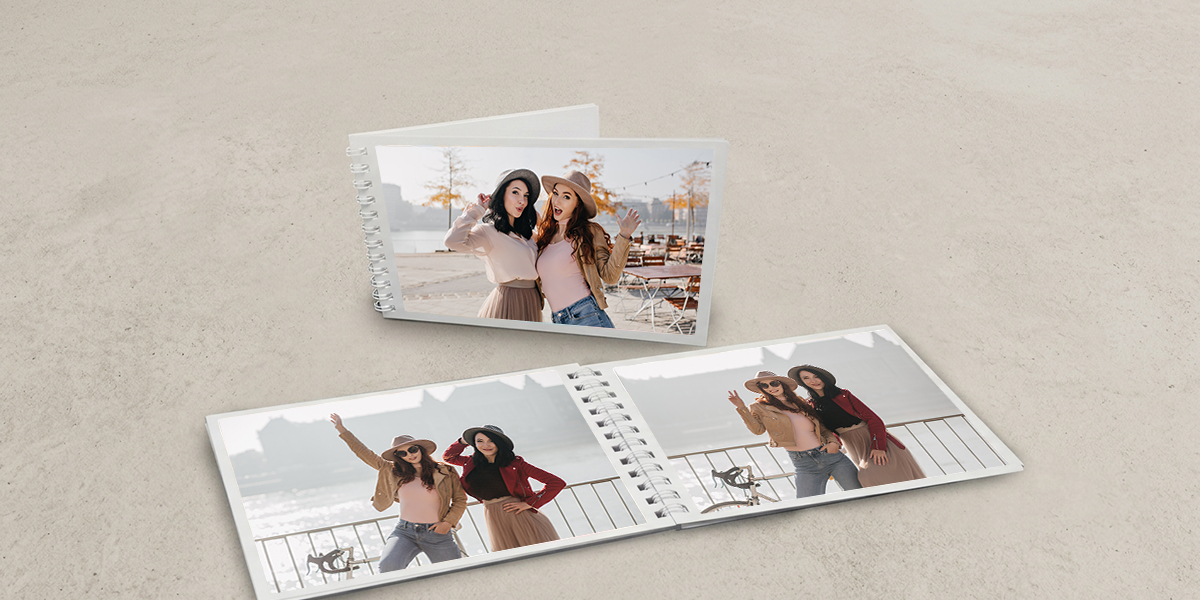 Personalised spiral friendship photo book featuring travel memories between best friends